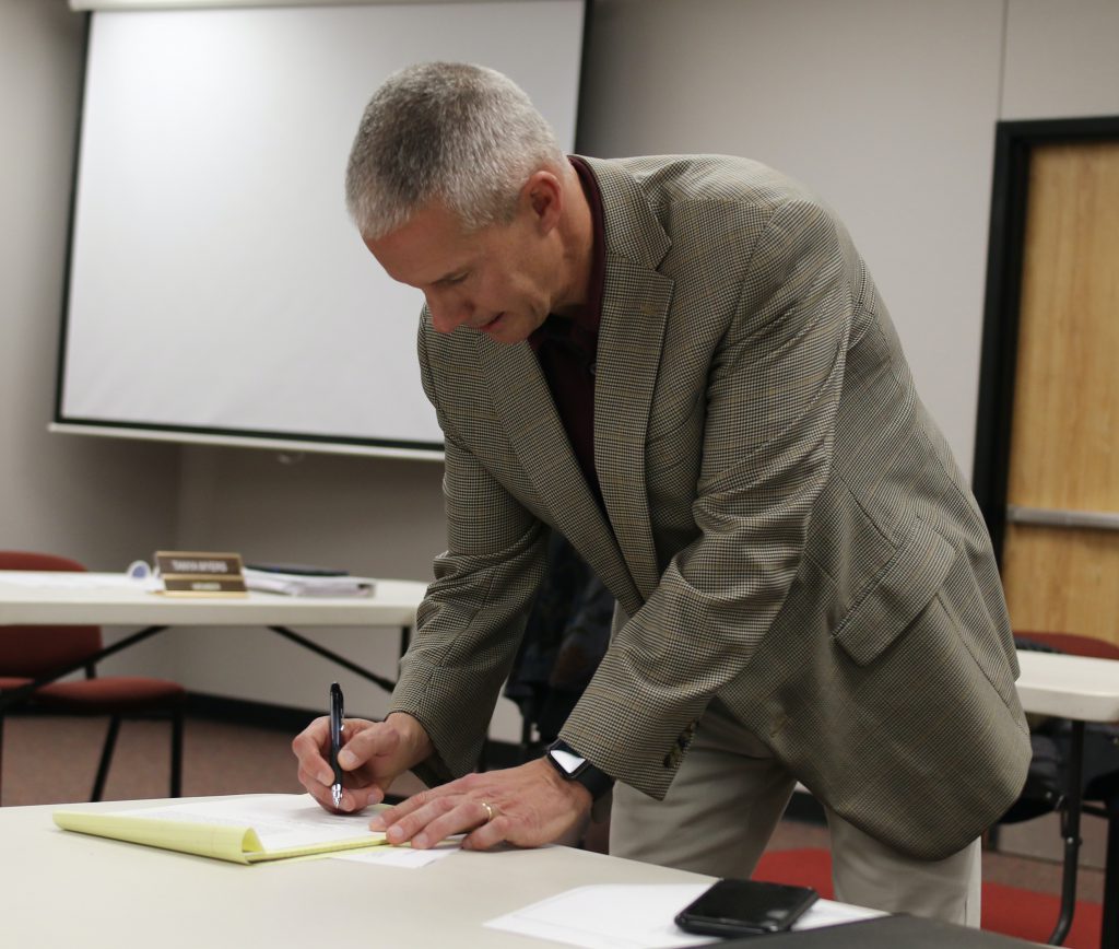 Dr Overbo signs supt contract